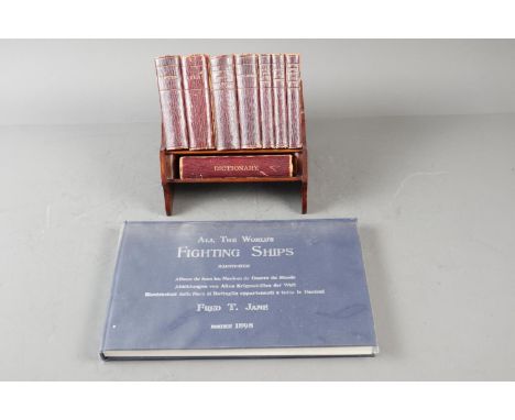 An Asprey's miniature reference library, 8 vols, in purpose made book trough, and a reprint of Janes "All the Worlds Fighting