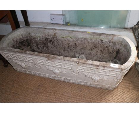 A rectangular cast stone planter, 36" wide