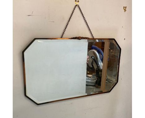An Art Deco style copper framed and bevel edged mirror 69cm x 40cm 