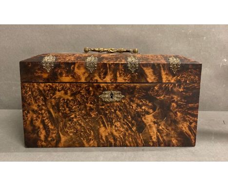 An antique tea caddy with ornate brass fitments and glass mixing bowl.