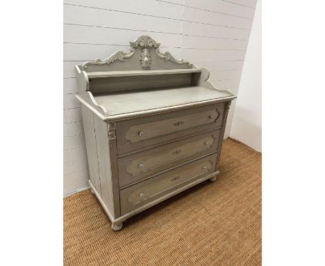 A French Louis style chest of drawers, the scrolling gallery back and shelf are sat upon a base of three long drawers and ter