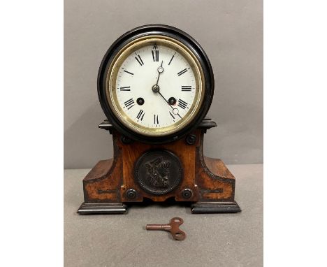 A cased mantel clock 