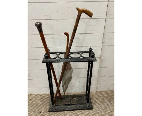 A cast iron stick stand with walking cane (H51cm W41cm D16cm)