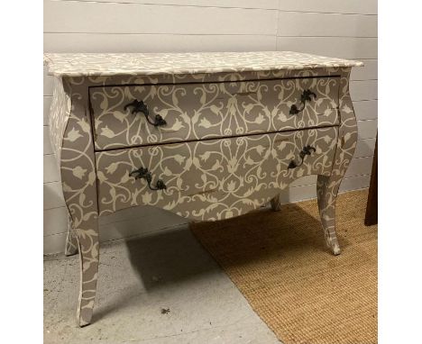 A two drawer bombe commode on down swept legs painted in grey with white tulip detail  l120X56 height 92