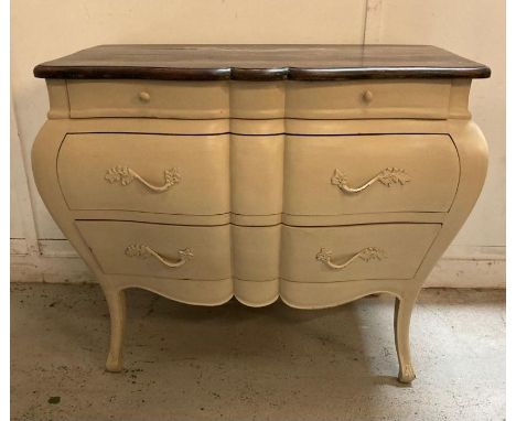 A white painted Louis XV style Bombe commode with three drawers and down swept legs Height 89 Width 114 Depth 57