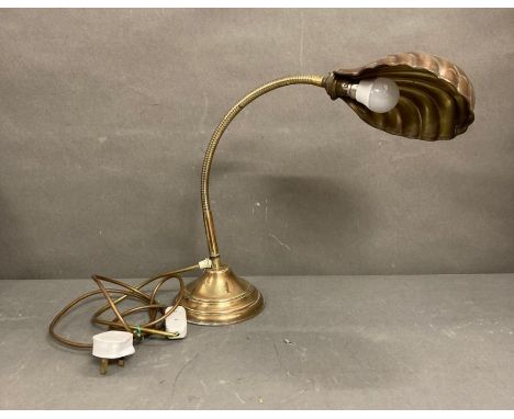 An art deco style brass shell table lamp