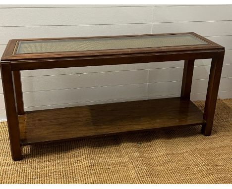 A console table with glass and woven top with a shelf under (H67cm W134cm D40cm)