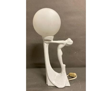 A white Art Deco style table lamp of a lady arching her back 