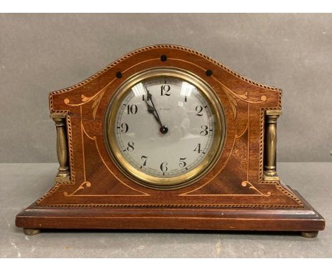 A mahogany inlaid eight day mantel clock 
