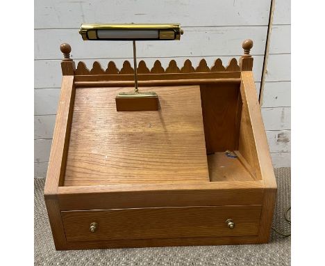 A light oak pulpit with reading light (H65cm W74cm D40cm)