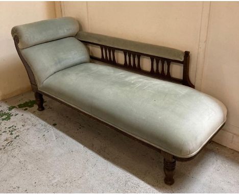An oak framed light blue upholstered chaise longue (H75cm W160cm D60cm)