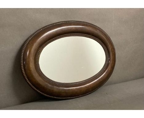 An oval mahogany framed hall mirror 53X48