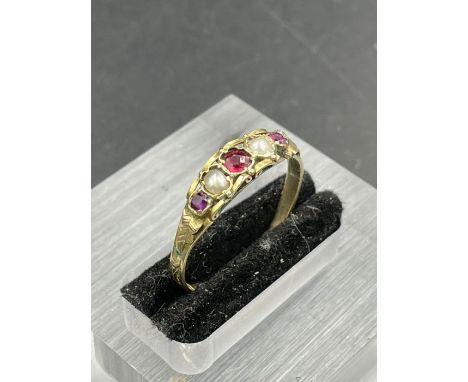 A 9ct gold ring with seed pearl and garnets (Approximate Total Weight 1.3g) Size R