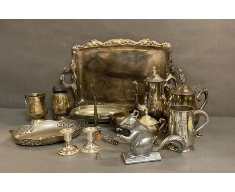 A collection of white metal items to include candlesticks, coffee pots and a squirrel nut cracker 