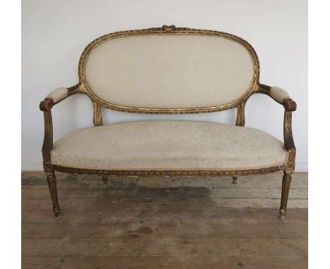 A two seater saloon sofa upholstered in white