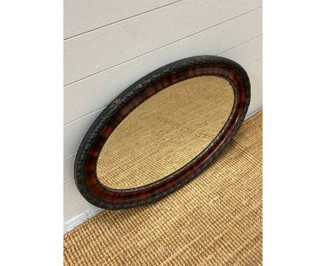 An oval wall mirror (56cm x 82cm)