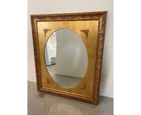 A wooden framed gold painted hall mirror 98cm x 119cm
