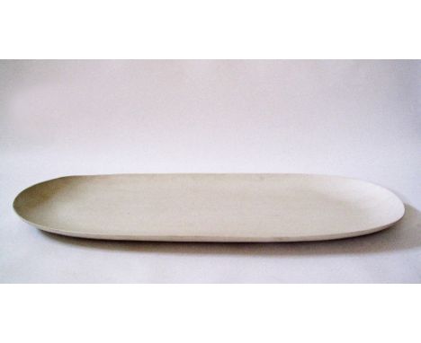 An oblong modern ceramic dish in off white clay by Rina Menardi, L97cm, W40cm.