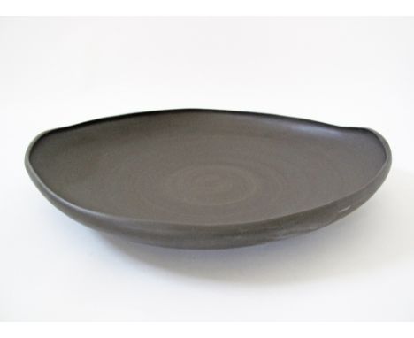 A Modern ceramic dish in brown clay by Rina Menardi W70cm. 