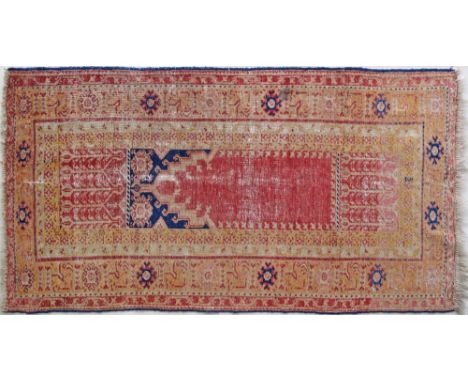 An antique Anatolia Turkish hand made wool carpet 110X210cm. Low pile, some parts no pile.