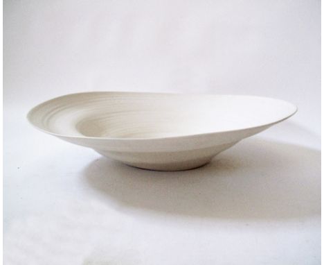 A Modern ceramic bowl in off-white clay by Rina Menardi, W70cm H15cm.