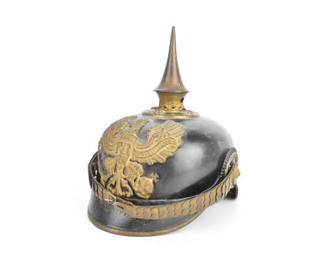 A WWI First World War German Army / Prussian 1895 model pickelhaube uniform helmet, leather construction with brass front pla