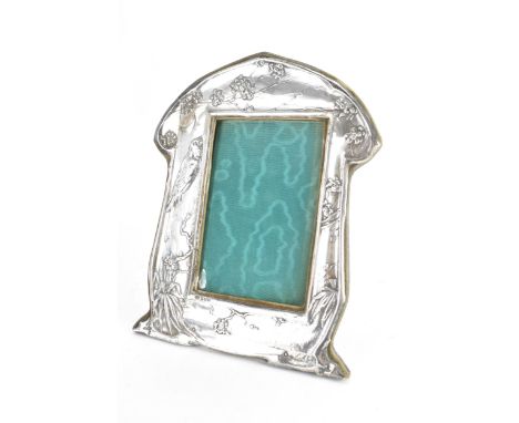 An Art Nouveau silver front photo frame, by Robert Pringle & Sons, hallmarked Birmingham 1906, embossed with a bird perched o