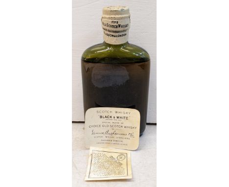 A Black & White special blend of choice old Scotch Whisky, James Buchanan & Co, label loose but present, 15cm highIf there is