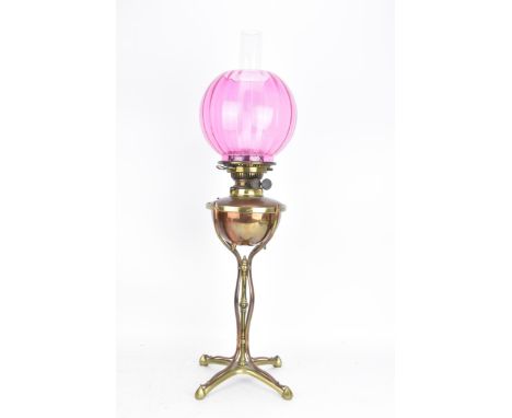 A William Arthur Smith Benson (1854-1924) Arts & Crafts oil lamp, circa 1890, the copper reservoir supported on three waisted