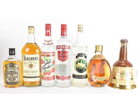 Eight bottles of alcohol to include Bell's blended scotch whisky 75cl, Chivas Regal whisky 50cl, Zubrowka Bison Brand whisky 