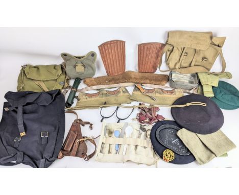A collection of mainly Second World War era military accessories to include an RAF small pack, a gas mask bag, US army bottle