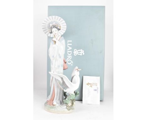 A Lladro figurine entitled 'Japanese Portrait' numbered 8253, with original box, stamped and impressed marks to the base, 39c