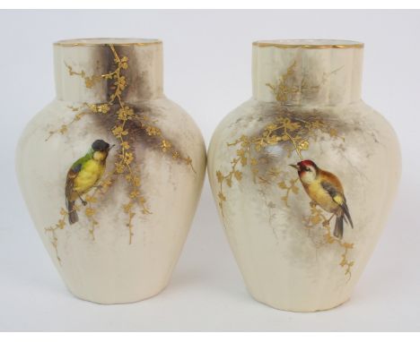 A pair of late 19th Century Grainger & Co, Worcester vases one painted with a goldfinch, the other a coal tit, sitting on blo