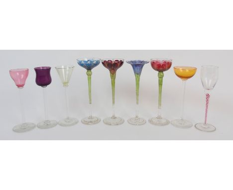 Four Art Nouveau Theresienthal enamelled liqueur glasses circa 1900, each painted with a different flower head, tallest 16.3c