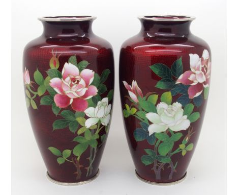 A pair of Chinese ginbari cloisonne baluster vases decorated with roses on a red ground, with silver mounted, 18cm high (2)