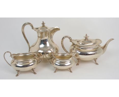 A four piece silver tea service by Atkin Brothers, Sheffield 1923, of baluster form with shaped borders on four pad feet, 185