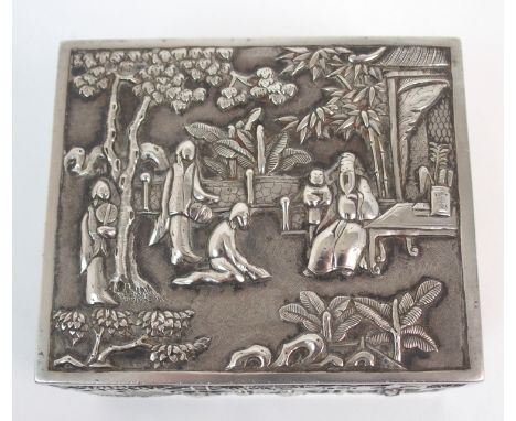 A Chinese silver box cast with panels of figures in garden settings beneath trees stamped LUENWO (corner cover split), 9.5cm 