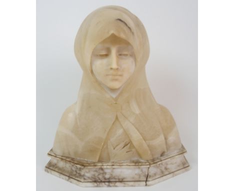 An alabaster bust of a girl wearing a head scarf, upon stepped base, 35cm high