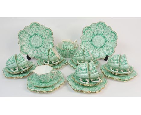 A Wileman Foley daisy shape Snowdrop pattern teaset the jade green pattern on a white ground, comprising two cake plates, twe