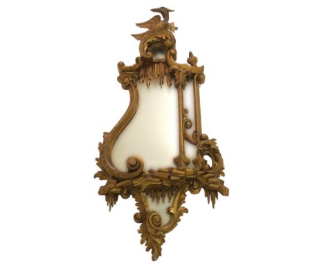 A Chinese Chippendale style gilt wood wall mirror with phoenix surmount resting on C scrolls above an urn, icicles, pillars a