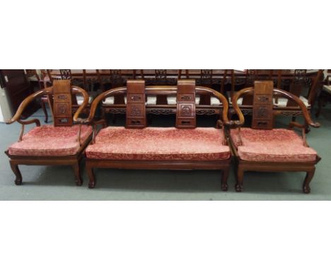 A Chinese hardwood three piece suitewith cushions comprising; two seater sofa with carved back and scroll arms, 80cm high x 1