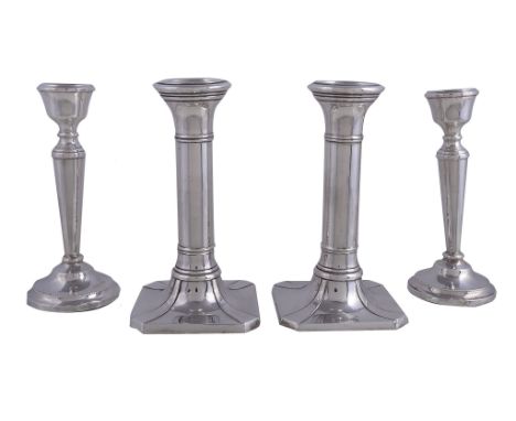  Two pairs of silver circular candlesticks,   the first  by S. Blanckensee  &  Son Ltd, Chester and Birmingham 1924, on squar