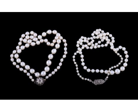  Two cultured pearl necklaces,   the first with a rose cut diamond set clasp, to graduated cultured pearls, 44cm long; togeth