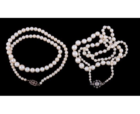  Two cultured pearl necklaces,   the first with a rose cut diamond set cluster clasp, to a row of graduated cultured pearls, 