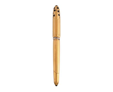  Cartier, Panthere, a gold plated fountain pen,   with reeded decoration, the cap with a clip, the barrel with a trinity band