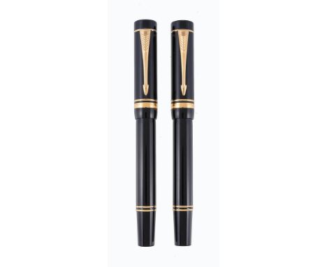  Parker, Duofold, International, a black fountain pen,   with a black cap and barrel, the medium nib stamped  18K, inked; tog