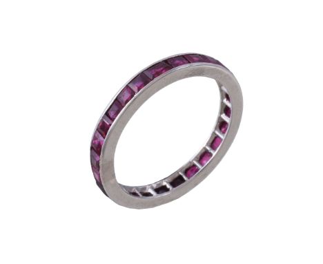  A mid 20th century ruby eternity ring,   set with square cut rubies, with a plain polished border, finger size N 