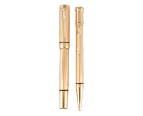  Parker, Duofold, Presidential, a gold plated fountain and ballpoint pen,   with reeded decoration, the fountain pen cap with