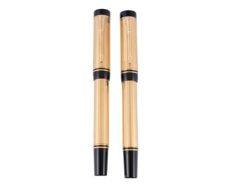  Parker, Duofold, International, a gold plated fountain pen and rollerball,   with reeded decoration, the fountain pen with a