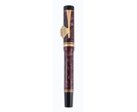  Parker, Duofold, Centennial, a burgundy marbled fountain pen,   the cap with gilt metal arrow clip and double cap band, the 